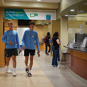 Two Knights athletes approach the cashier station in Wenatchi Hall.