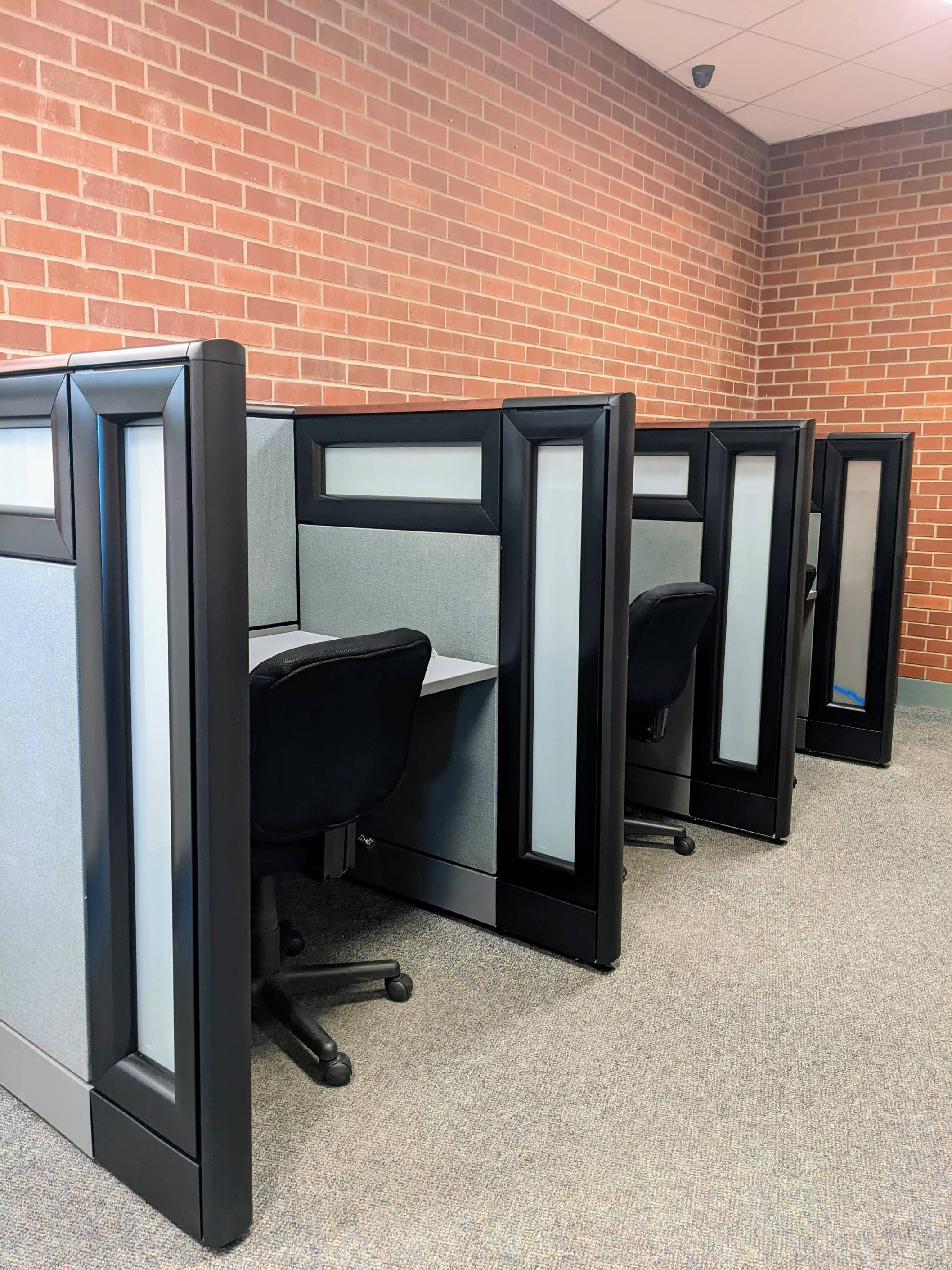 Distraction Reduced testing area -three cubicles with rolling chairs